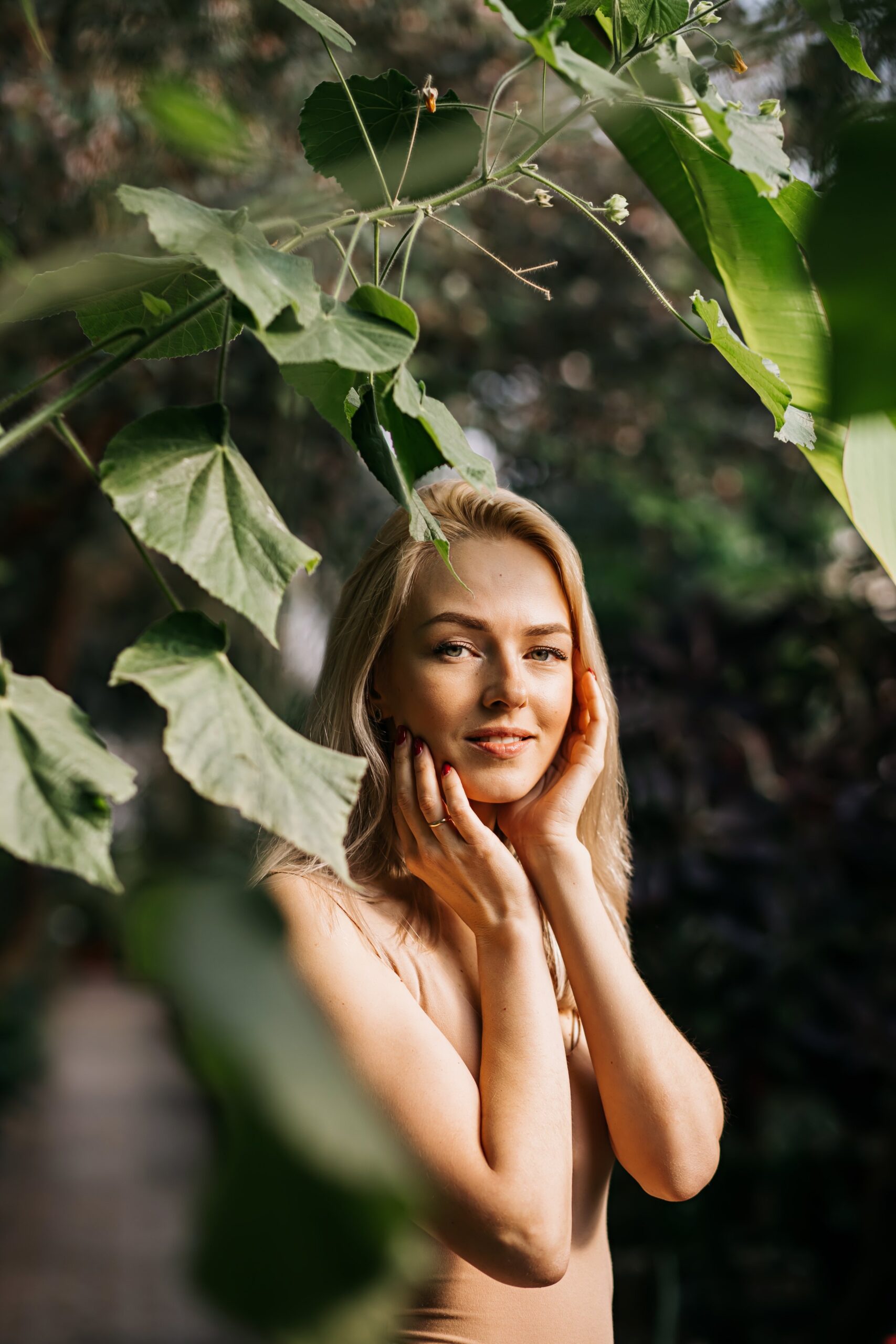 Woman in swimsuit on tropical plants background Peaches & Co Memberships