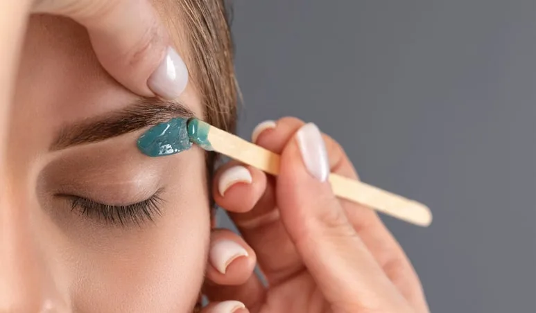 woman-getting-eyebrows-waxed-2-min woman getting eyebrows waxed 2 min 1